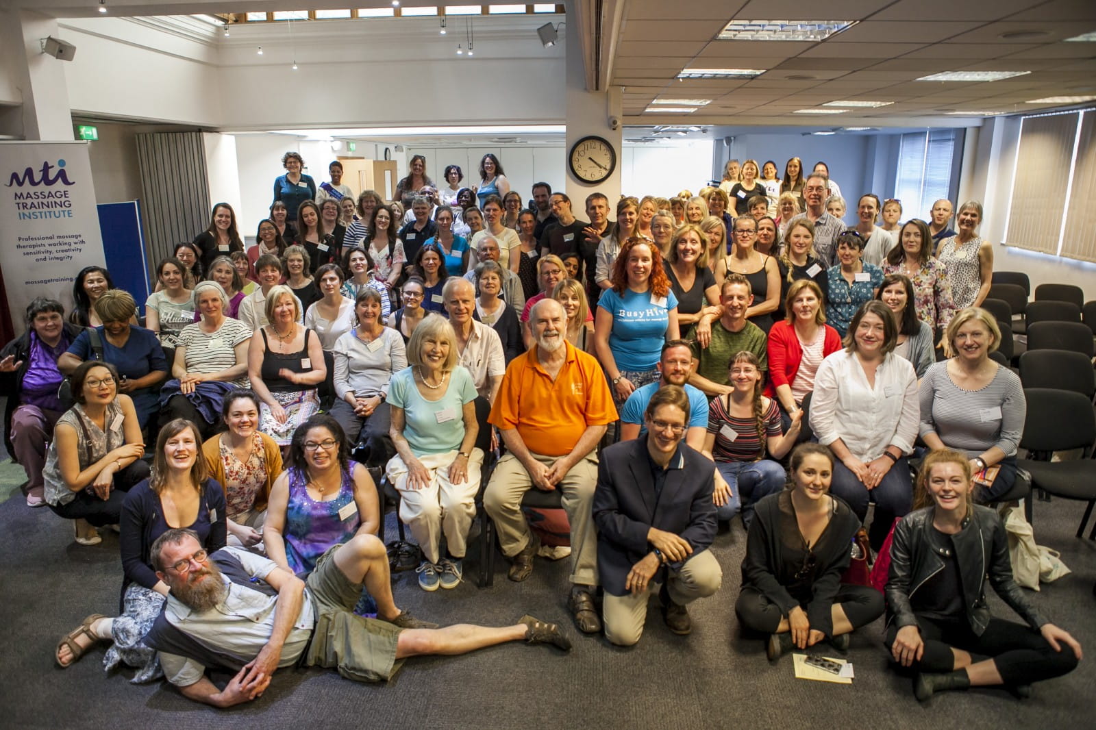 Group pic at 2018 conference with new logo banner stand